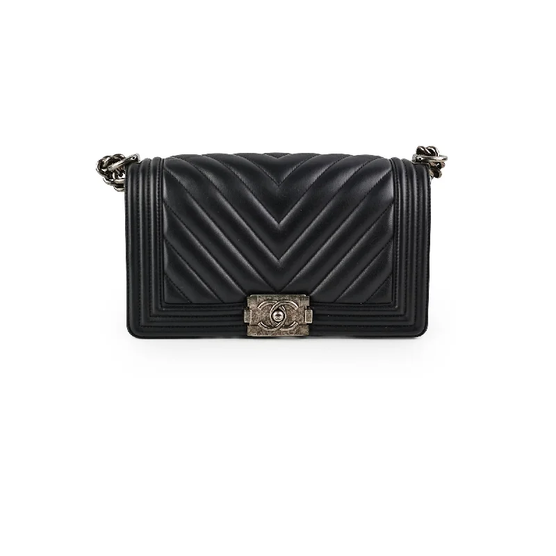 Trendy handle bags with geometric patterns for a modern, artistic look-Chanel Boy Old Medium Black Chevron