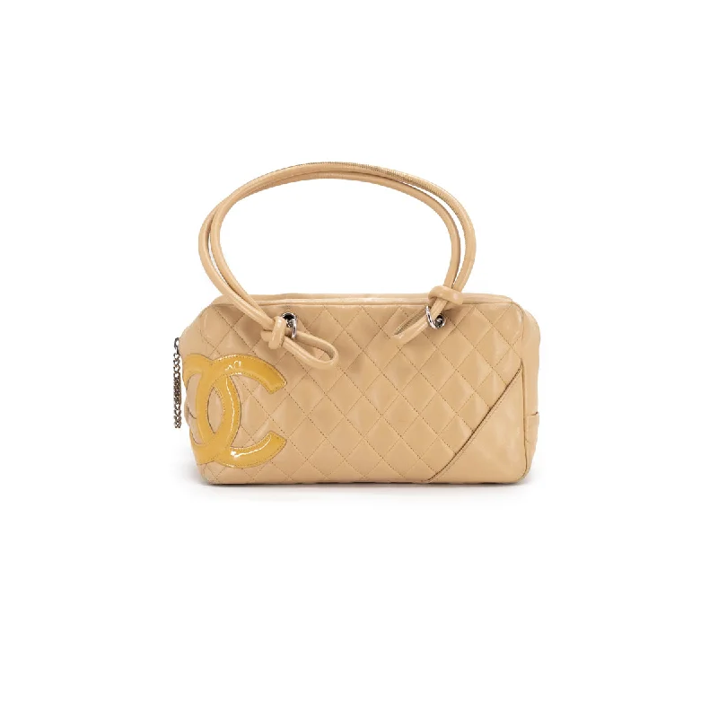 Handle bags with detachable pouches for added organization and convenience-Chanel Quilted Calfskin Top handle Bag Beige