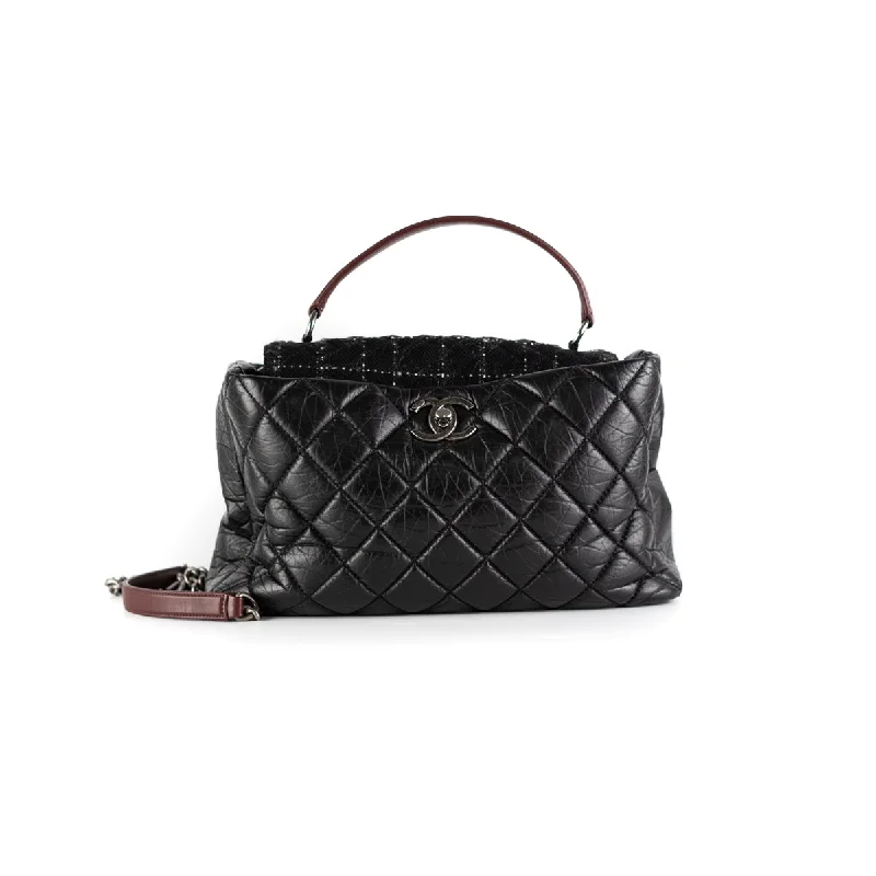 Handle bags with large, front flaps for a stylish and functional closure option-Chanel Quilted Portobello Top Handle Tote Black