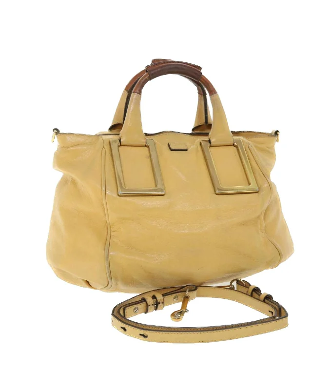 Handle bags with sleek, metal frame designs for a structured, high-fashion appeal-Yellow Leather 2way Hand Bag with Shoulder Strap