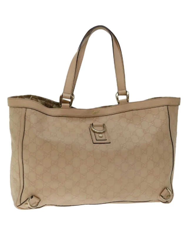 Handle bags with faux fur accents for a cozy and chic winter look-Canvas Tote Bag with Signature Gucci Pattern