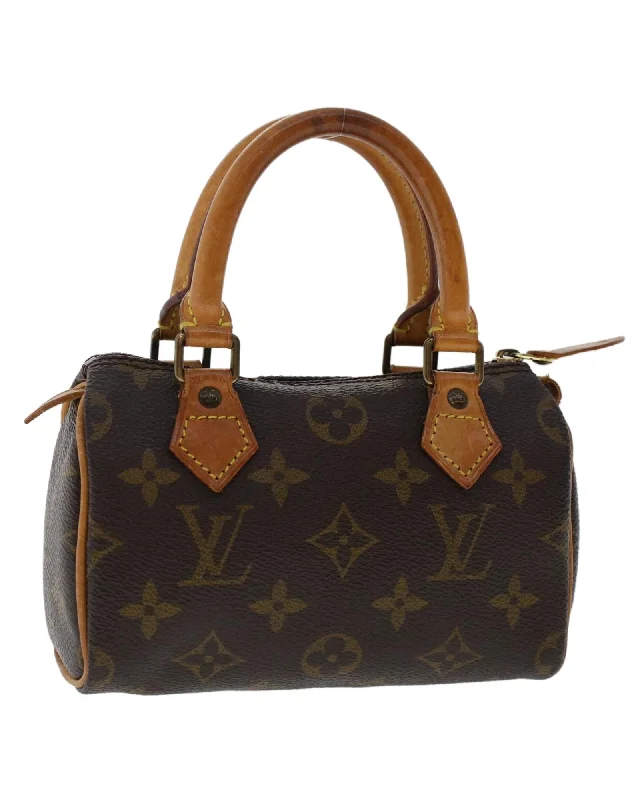 Trendy handle bags with bold colors for a fashionable and eye-catching design-Monogram Mini Hand Bag in Canvas