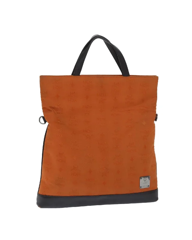 Best handle bags with metallic studs for an edgy, rock-inspired appearance-Nylon Logogram Hand Bag in Orange by MCM