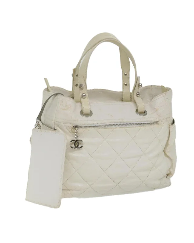 Best handle bags with playful tassel accents for a fun and trendy style-Coated Canvas Tote Bag with White CC Design - Authentic CHANEL Paris