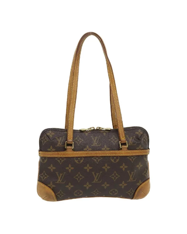 Handle bags with structured designs for a sleek and polished silhouette-Monogram Mini Coussin PM Hand Bag