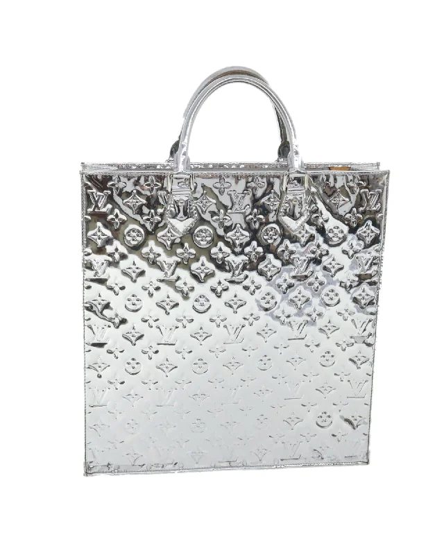 Best handle bags with reversible designs for two stylish looks in one-Reflective Monogram Hand Bag with Silver Tone Hardware